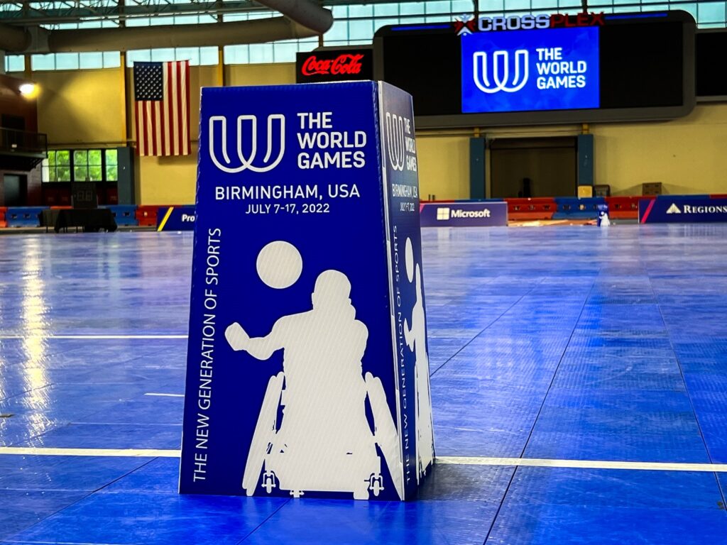 Blue wheelchair rugby court with blue goal marker featuring The World Games logo